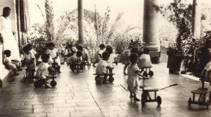 Birds' Nest children playing on carts made by older orphan  boys at Maameltein Orphanage. Nellie Miller's original caption reads: 