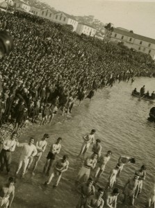 A massive crowd of men on the shoreline at Kavalla, Greece. The men are engaged in a Christian ritual in celebration of Epiphany.