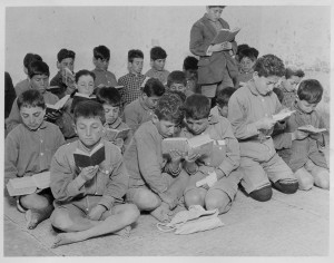 Young boys attend a class outside