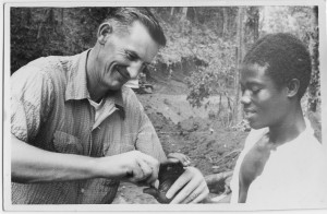 Near East Foundation physican Dr. Emery Howard cares for a young patient in Ghana.