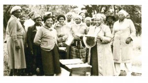 Members of the local home economics department show off their beekeeping skills. The women received training and equipment through the Near East Foundation. 