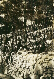 A group of boys pose on a hillside at Syra Orphanage. The orphanage housed 3,000 boys and girls and included an agricultural school.