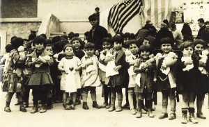 Young children from Syra Orphanage receive dolls donated by well-wishers in the United States.