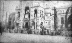 Large group of men in front of a building