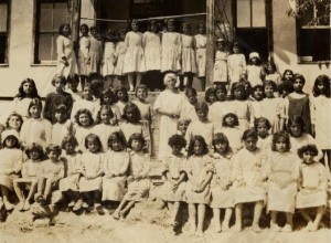 Mabel Elliott surrounded by children