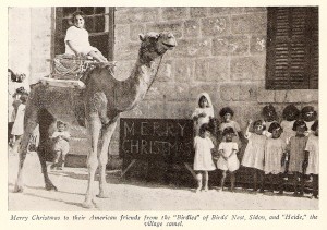 Orphans with camel at Christmas