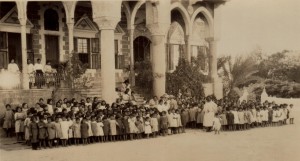 Group of children gather outside the Birds' Nest Orphanage