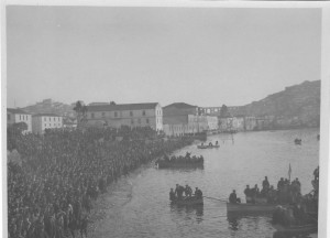 A massive crowd of men on the shoreline at Kavalla, Greece. The men were probably involved in a Christian religious ceremony that reenacts the baptism of Jesus Christ.