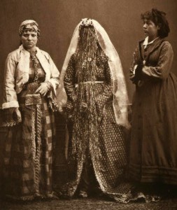 Studio portrait of an Armenian bride, Jewish woman, and a young Greek girl