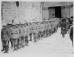 Boys in uniform line up in front of St. James Orphanage, Jerusalem. The original caption reads 