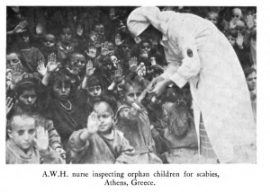 Nurse inspecting children for scabies