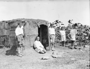 Boys pose with a hut that they built themselves in the garden at Polygon Orphanage, which was part of the orphanage complex at Alexandropol. Polygon doubled as an agricultural school.
