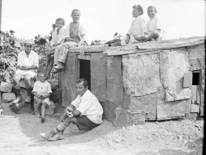 Boys sit on the roof of a small house that they built themselves at Polygon Orphanage in Alexandropol. 