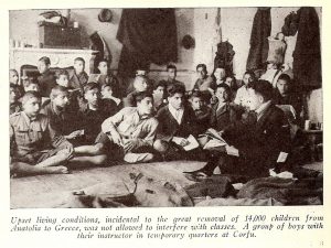 Boys attending class in a temporary classroom in Corfu, Greece. This photograph appeared in the October 1923 issue of the New Near East magazine.